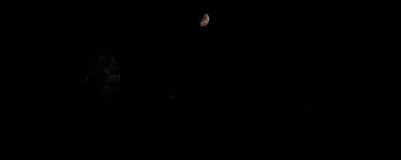 《沙丘:觉醒》游戏场景截图,展示荒漠地貌与玩家建造的基地,远处可见沙虫爬行的痕迹