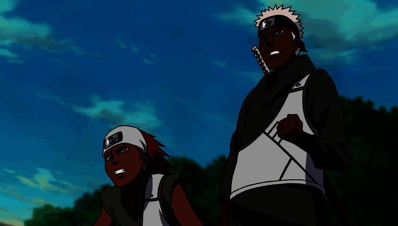 卡鲁伊与奥摩伊并肩站立,背景为忍者联军作战场景