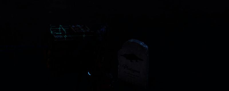 《死亡搁浅2》中主角在荒野为死去的动物建立墓碑的静谧场景，背景为灰暗天空与孤寂地形，画面充满诗意与哀思